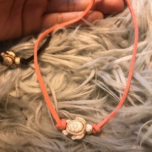 4 various colored turtle chockers